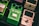 Several guitar effects pedals are arranged closely together. The green pedal in the center is labeled 'Tube Screamer' by Ibanez, an overdrive pro TS808 model. To the right, a cream colored pedal labeled 'Polytune 3' by Bonafide is visible. Another green Ibanez pedal is partially visible on the left.
