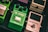 Several guitar effects pedals are arranged closely together. The green pedal in the center is labeled 'Tube Screamer' by Ibanez, an overdrive pro TS808 model. To the right, a cream colored pedal labeled 'Polytune 3' by Bonafide is visible. Another green Ibanez pedal is partially visible on the left.