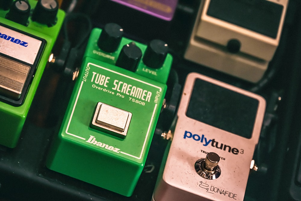 a group of different pedals sitting on top of a keyboard