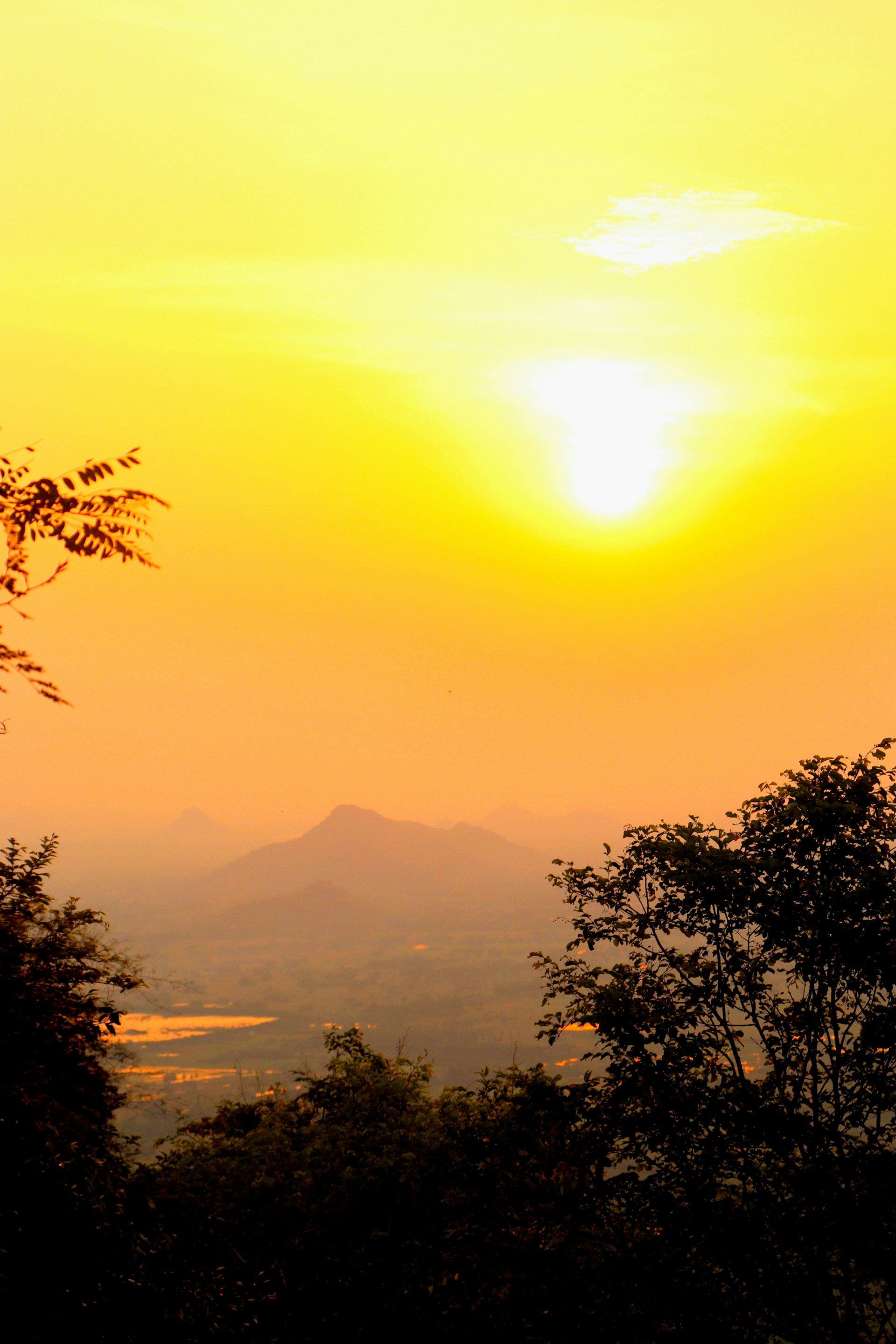 woman wearing yellow long-sleeved dress under white clouds and blue sky during daytime