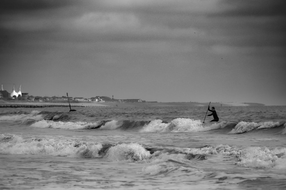 a person riding a surfboard on a wave in the ocean