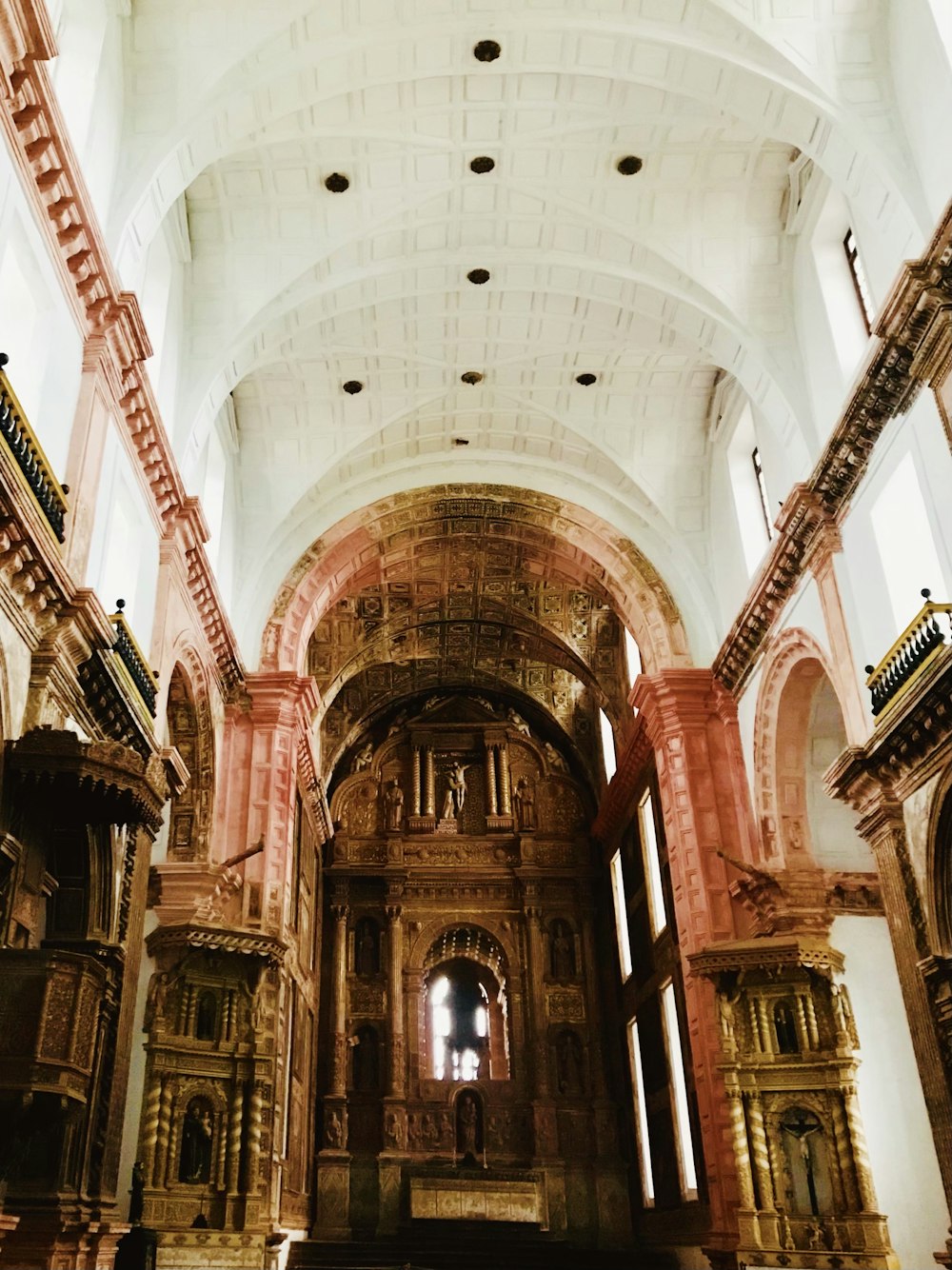 the inside of a church with high ceilings