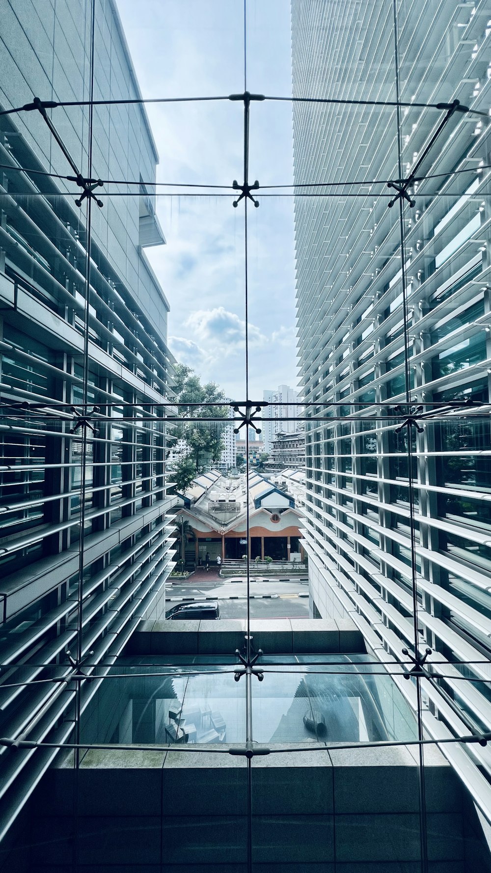 a reflection of a building in a glass window