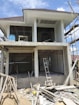 a house under construction with scaffolding around it