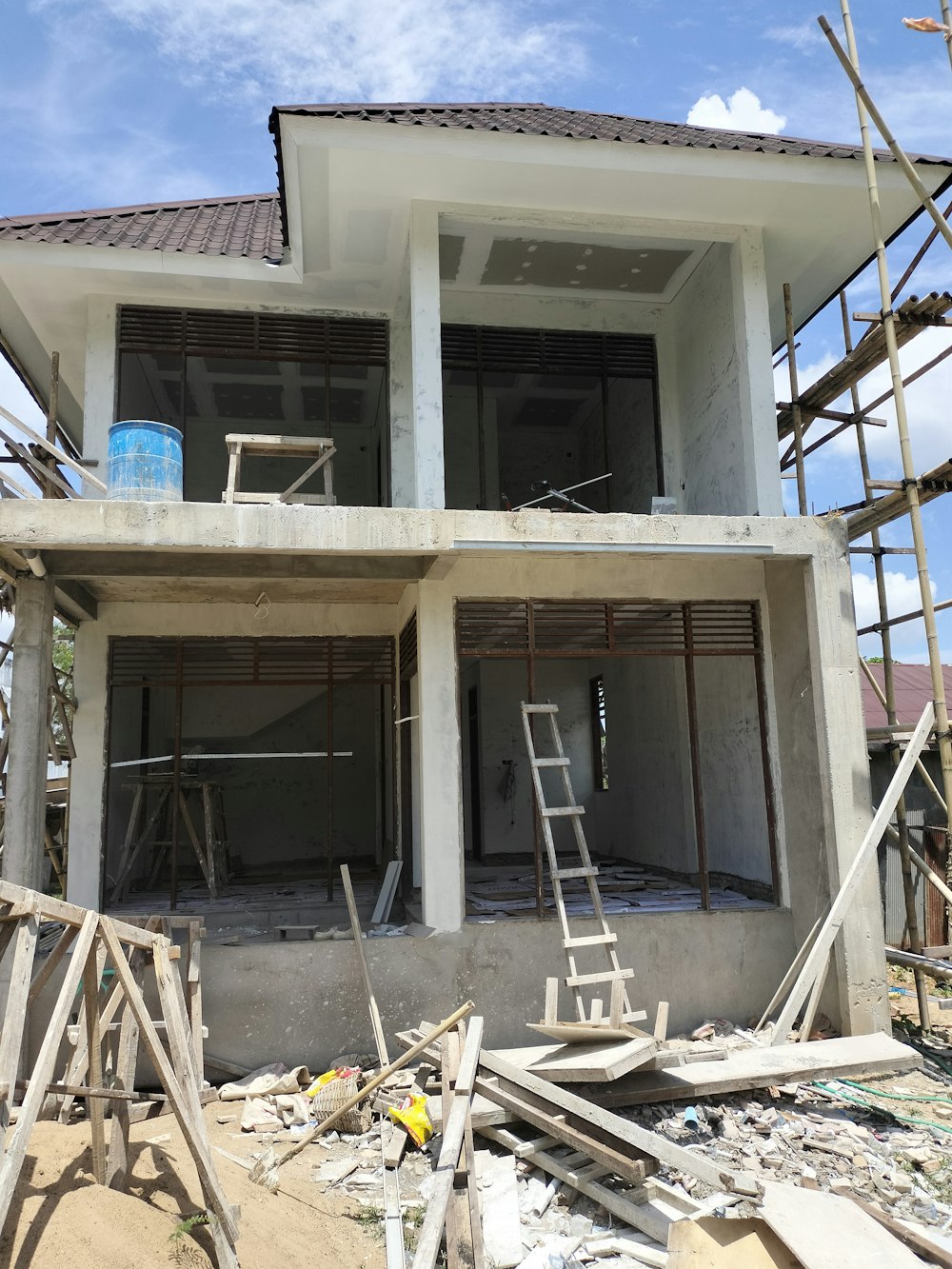 a house under construction with scaffolding around it