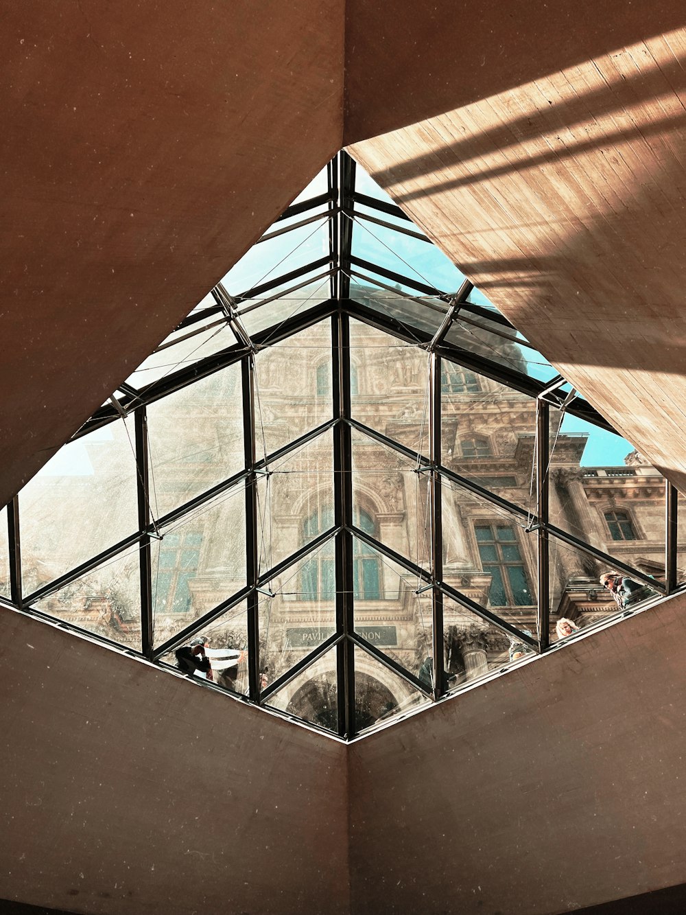 a building with a glass roof and a skylight