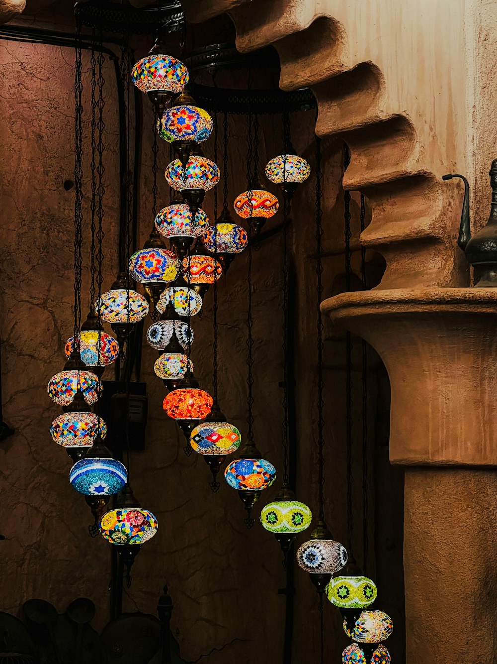 a spiral staircase made of colorful glass balls