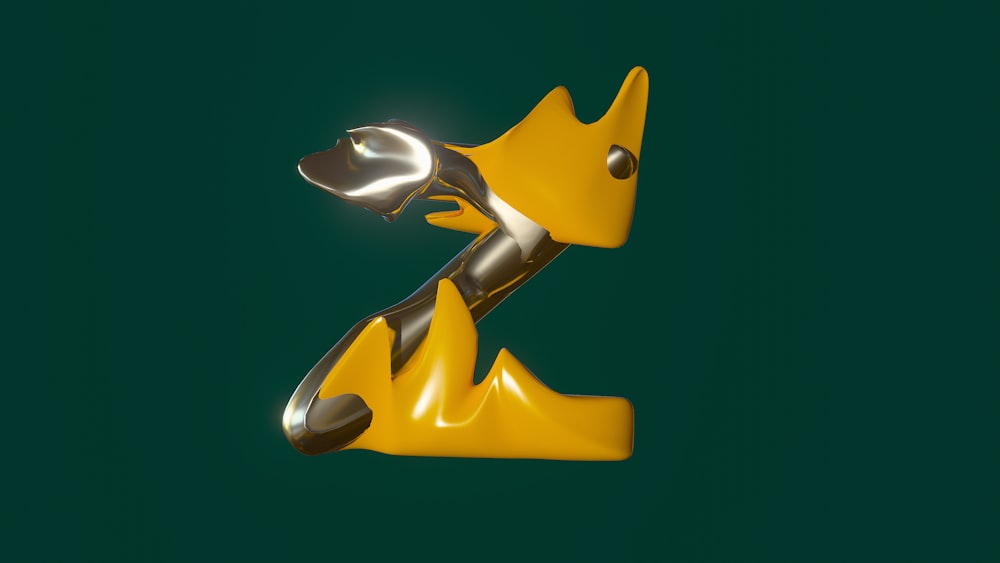 a yellow and silver object on a green background