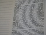 A close-up view of a page from a Bible, featuring printed text which speaks about divine retribution and behaviors of ancestors. The paper is slightly yellowed, and there are visible horizontal lines in the margins.