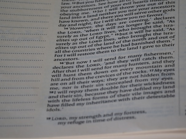 A close-up of a page from a religious text, featuring columns of typeset text with section numbers in bold. The focus is on specific passages discussing themes of prophecy and restoration.