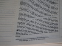 A close-up of a page from a religious text, featuring columns of typeset text with section numbers in bold. The focus is on specific passages discussing themes of prophecy and restoration.
