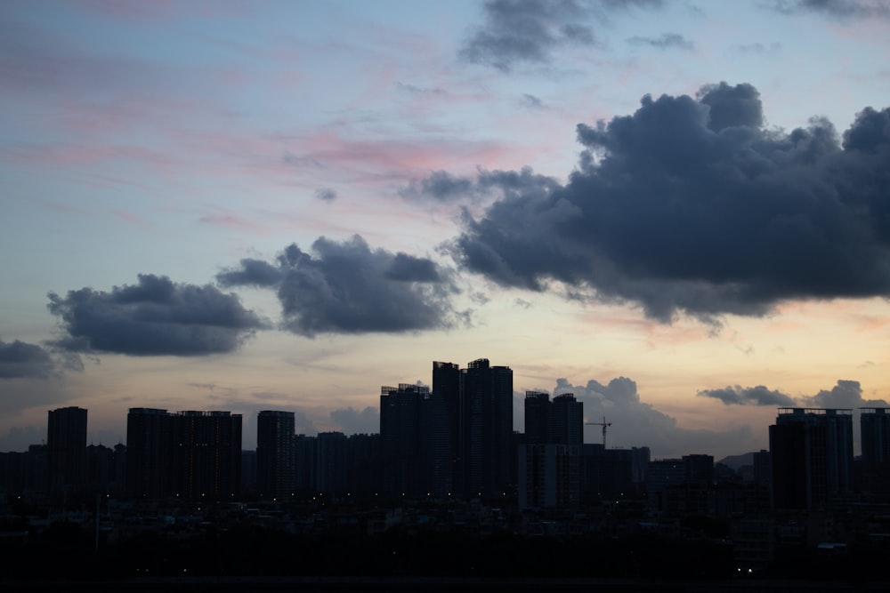 a view of a city skyline at sunset