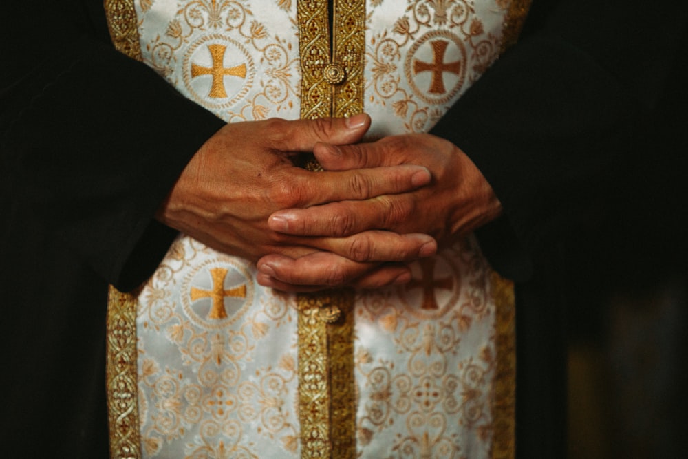 a close up of a person holding the hands of another person