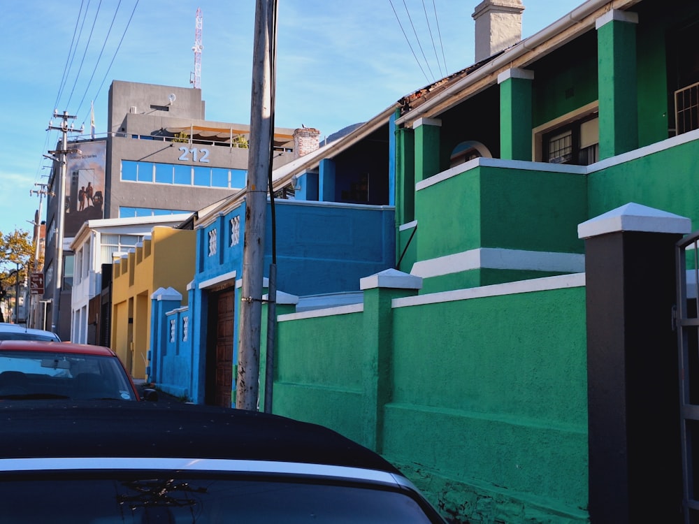 a car parked on the side of a road next to a building