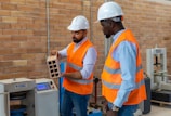Workers inspecting cement quality in the manufacturing plant.