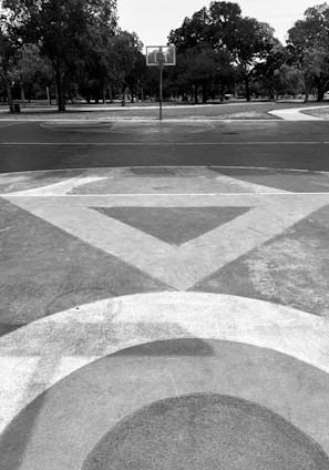 a black and white photo of a street corner