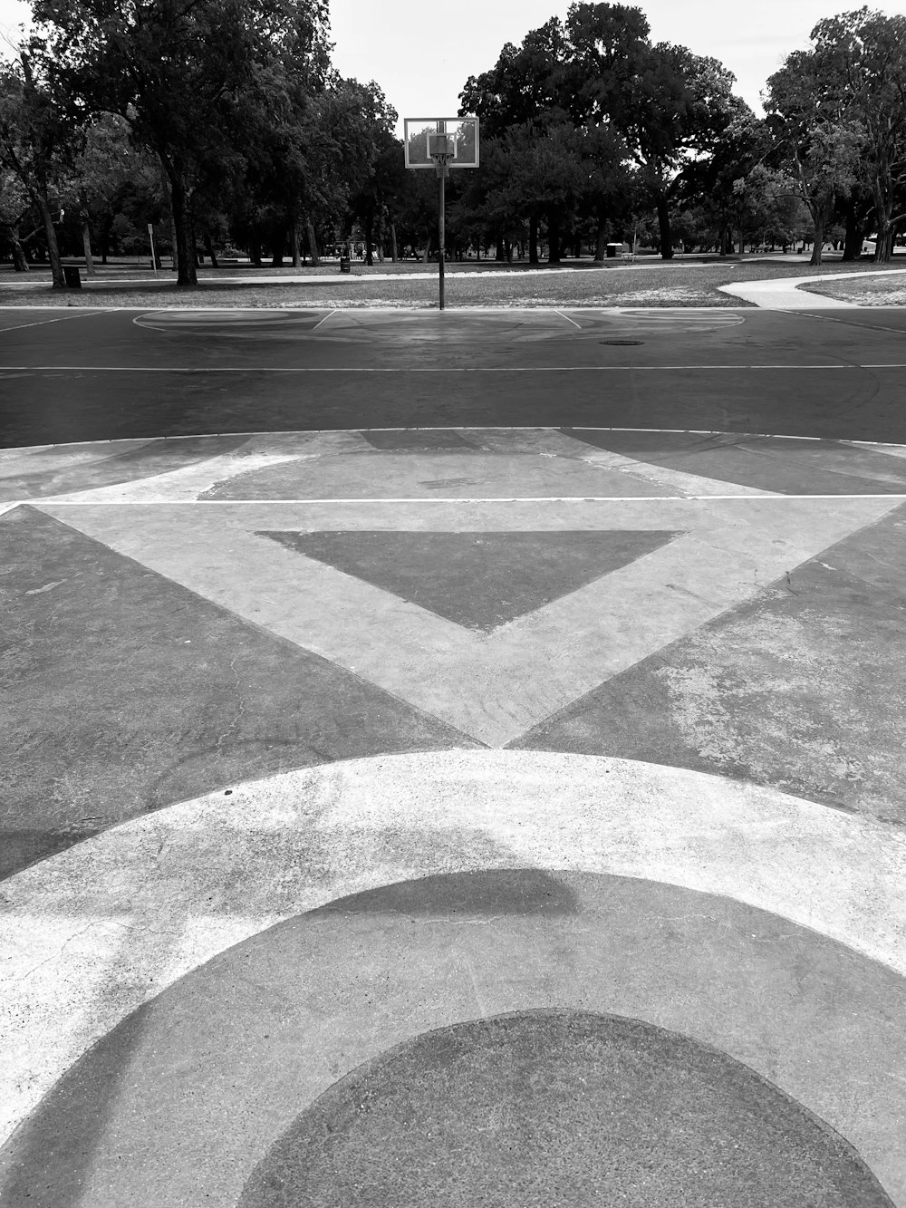 a black and white photo of a street corner