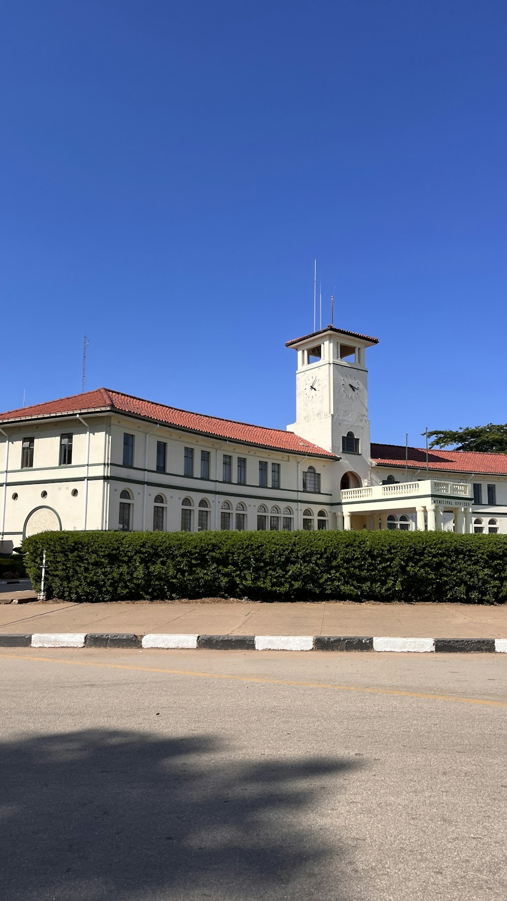 a large white building with a clock tower