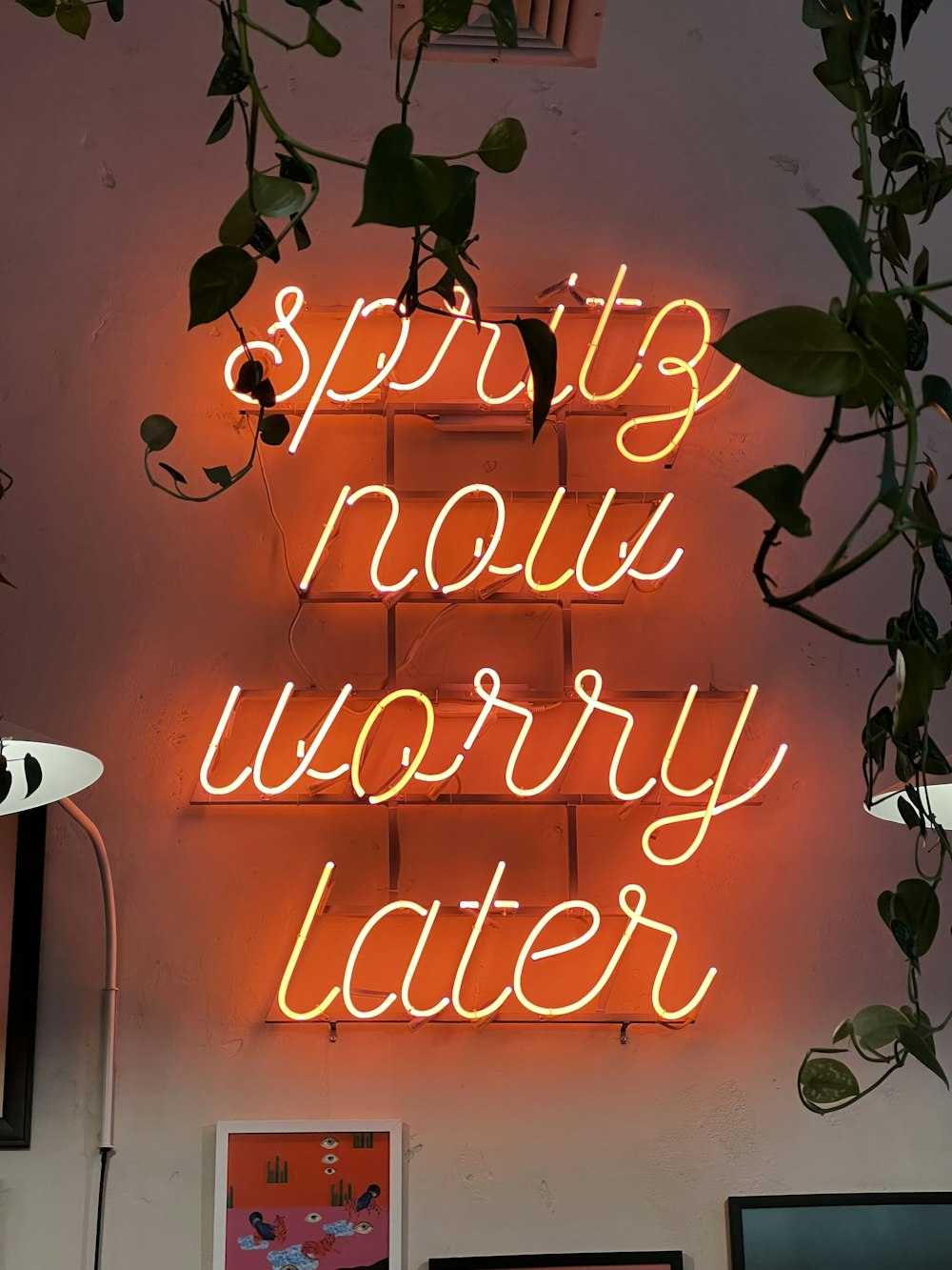 a neon sign that says spring now worry later