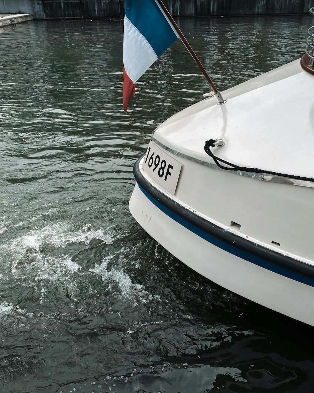 a boat with a flag is in the water