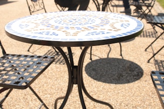 a table and chairs sitting on a patio