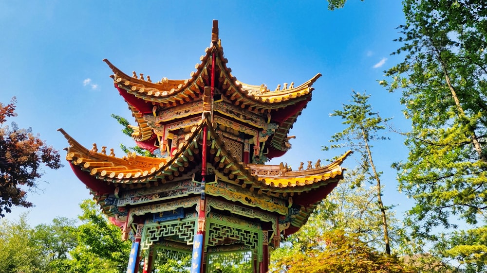 a tall tower with a sky background in a park