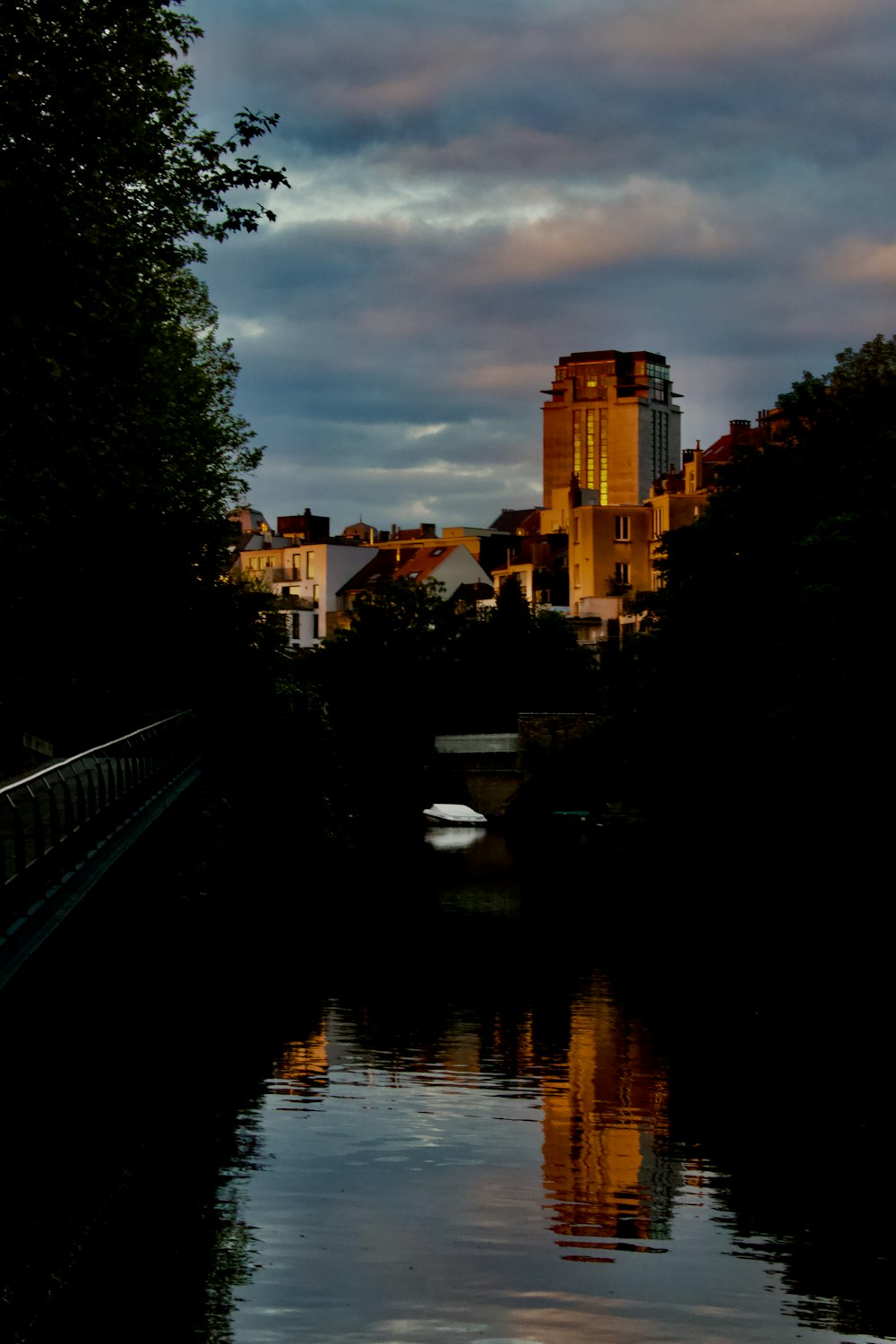 a body of water with buildings in the background