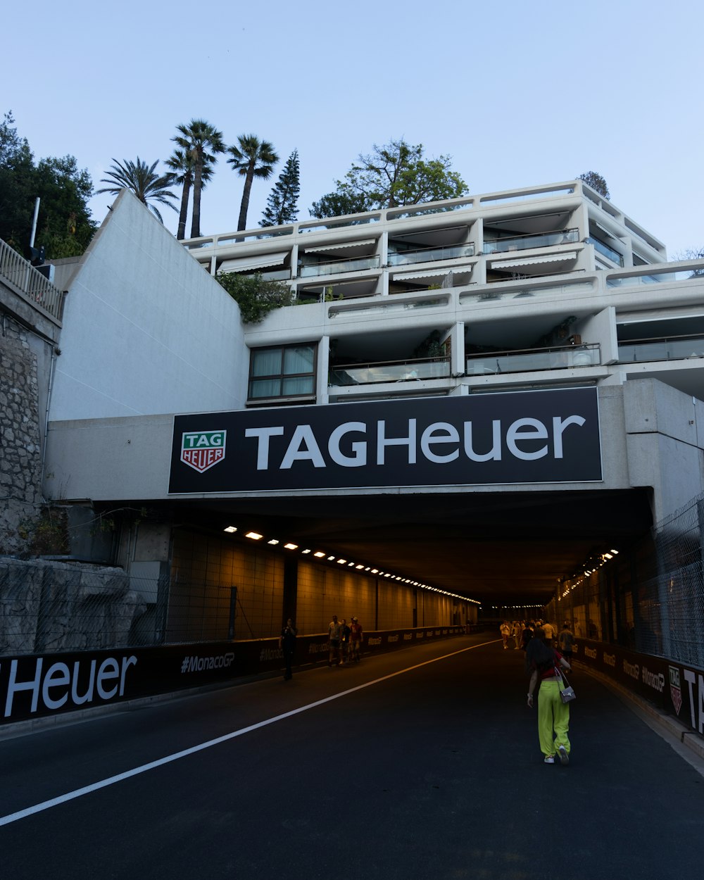 a person walking under a tunnel under a building