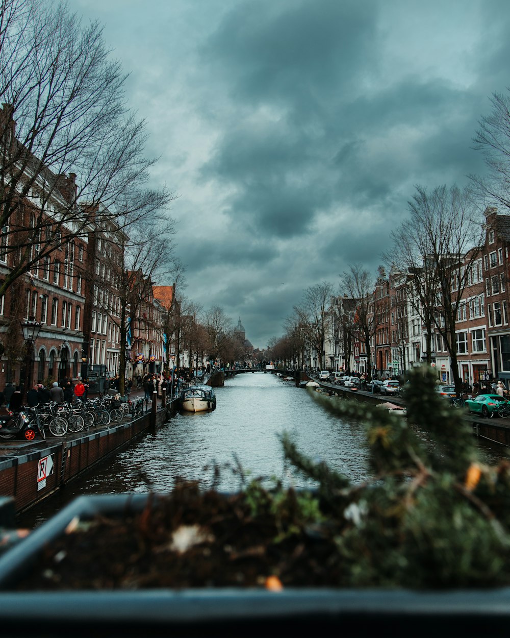 a river running through a city next to tall buildings