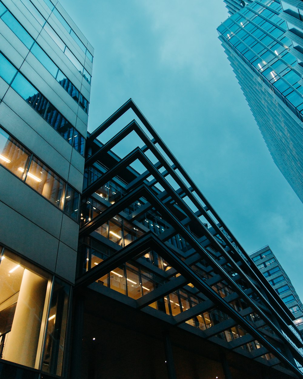 a tall building with lots of windows next to another building