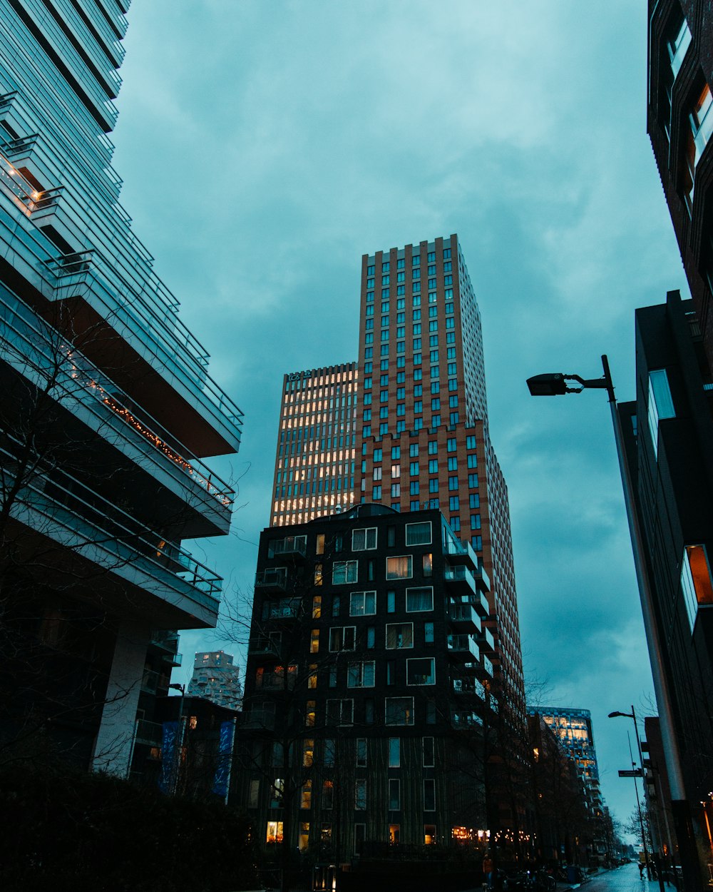 a very tall building sitting next to other tall buildings