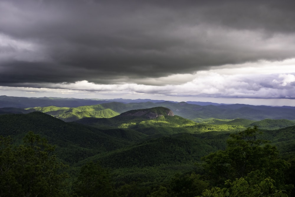 a view of a mountain range under a cloudy sky