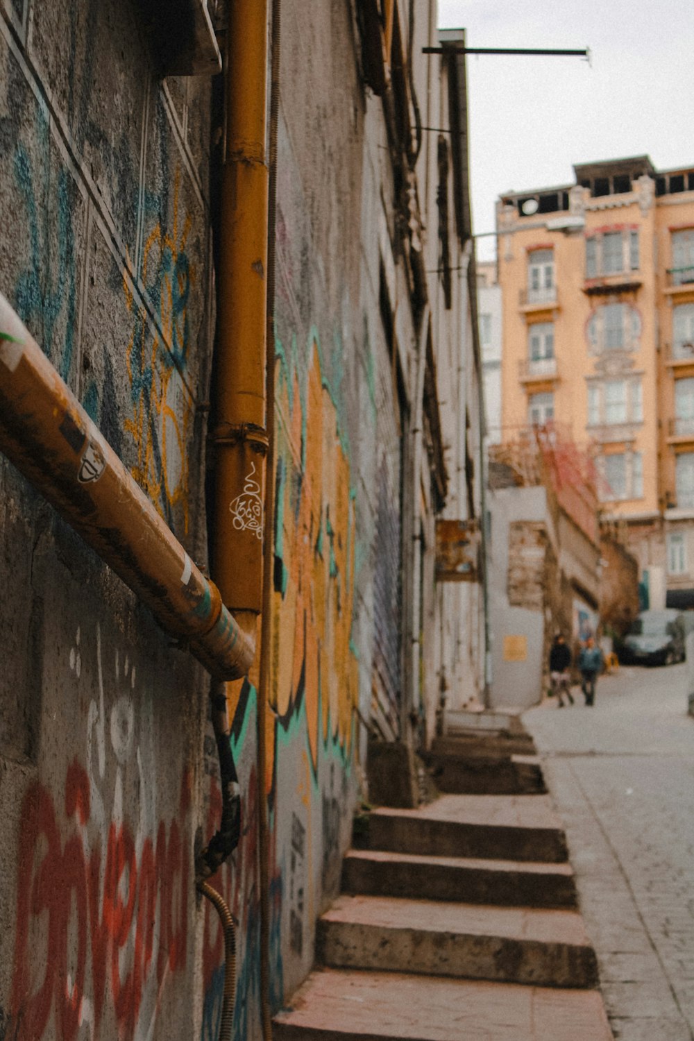 a set of steps leading up to a building with graffiti on it