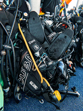 Close-up of diving equipment being checked before a dive.