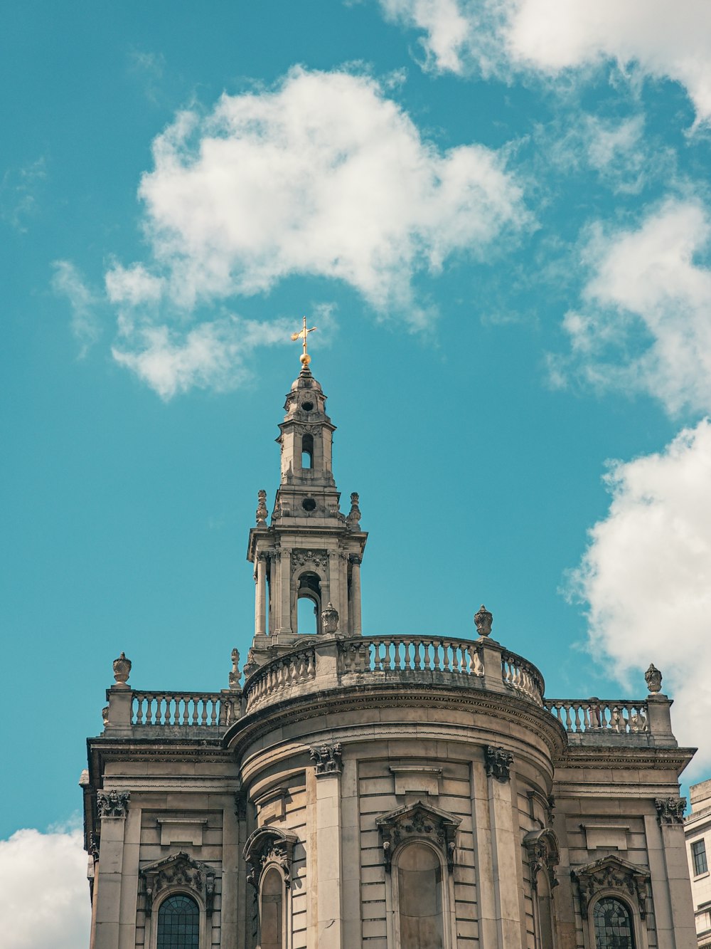 a tall building with a clock on the top of it