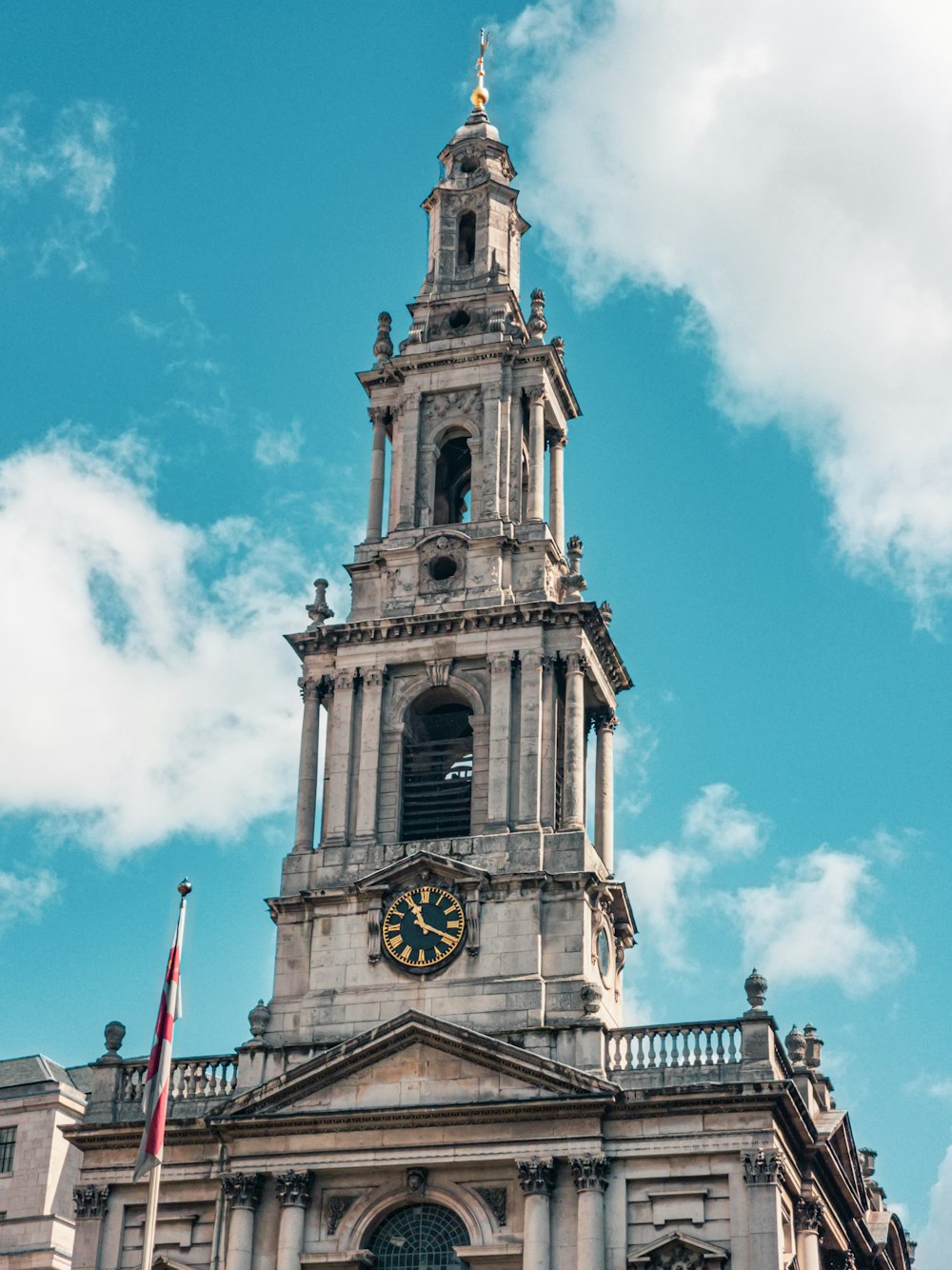 a tall tower with a clock on the top of it