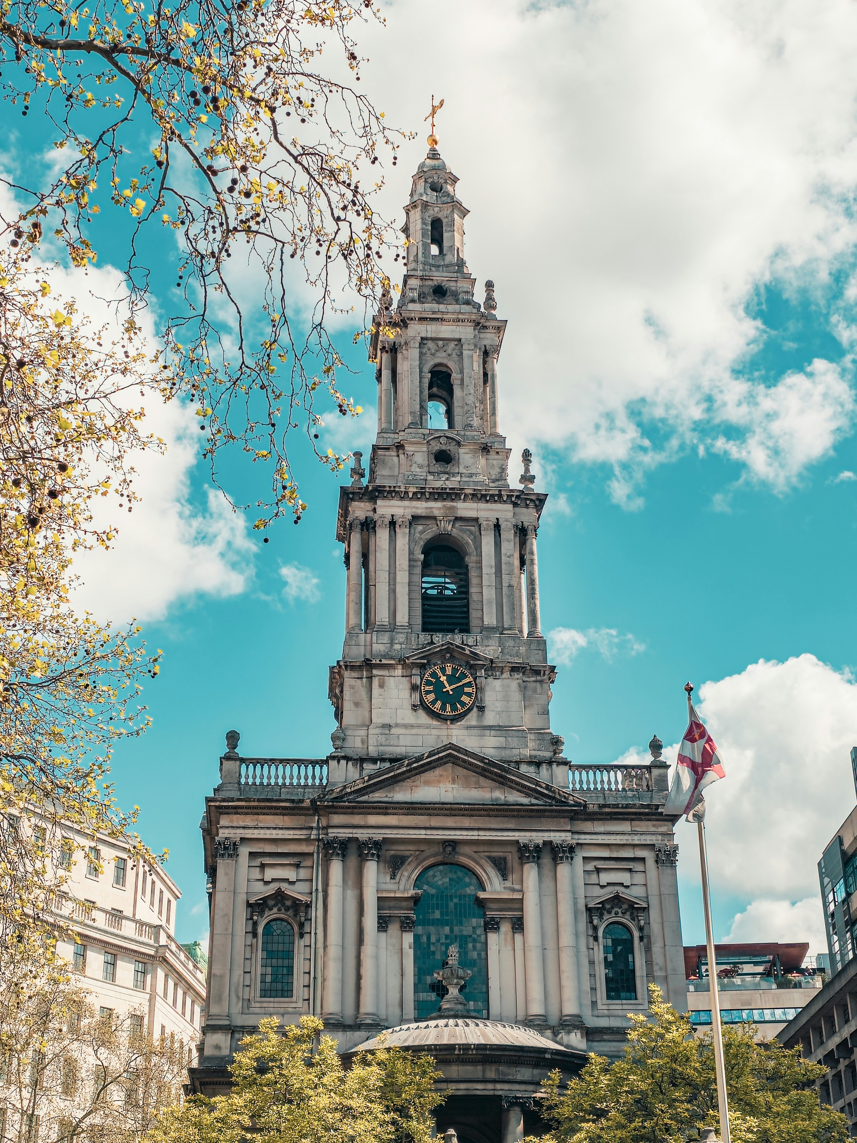 a tall building with a clock on the front of it