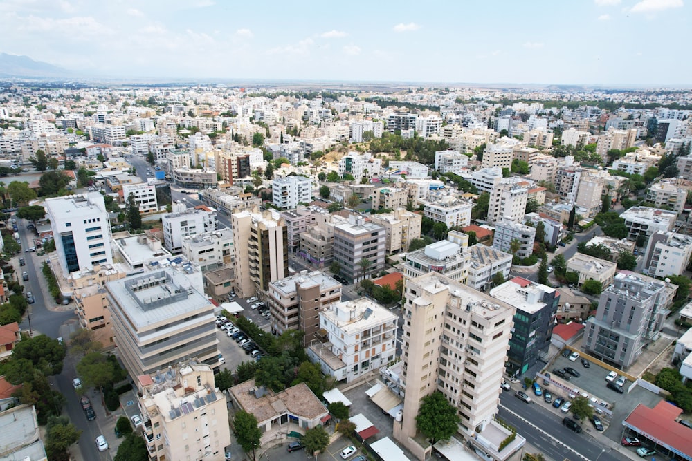 an aerial view of a city with tall buildings