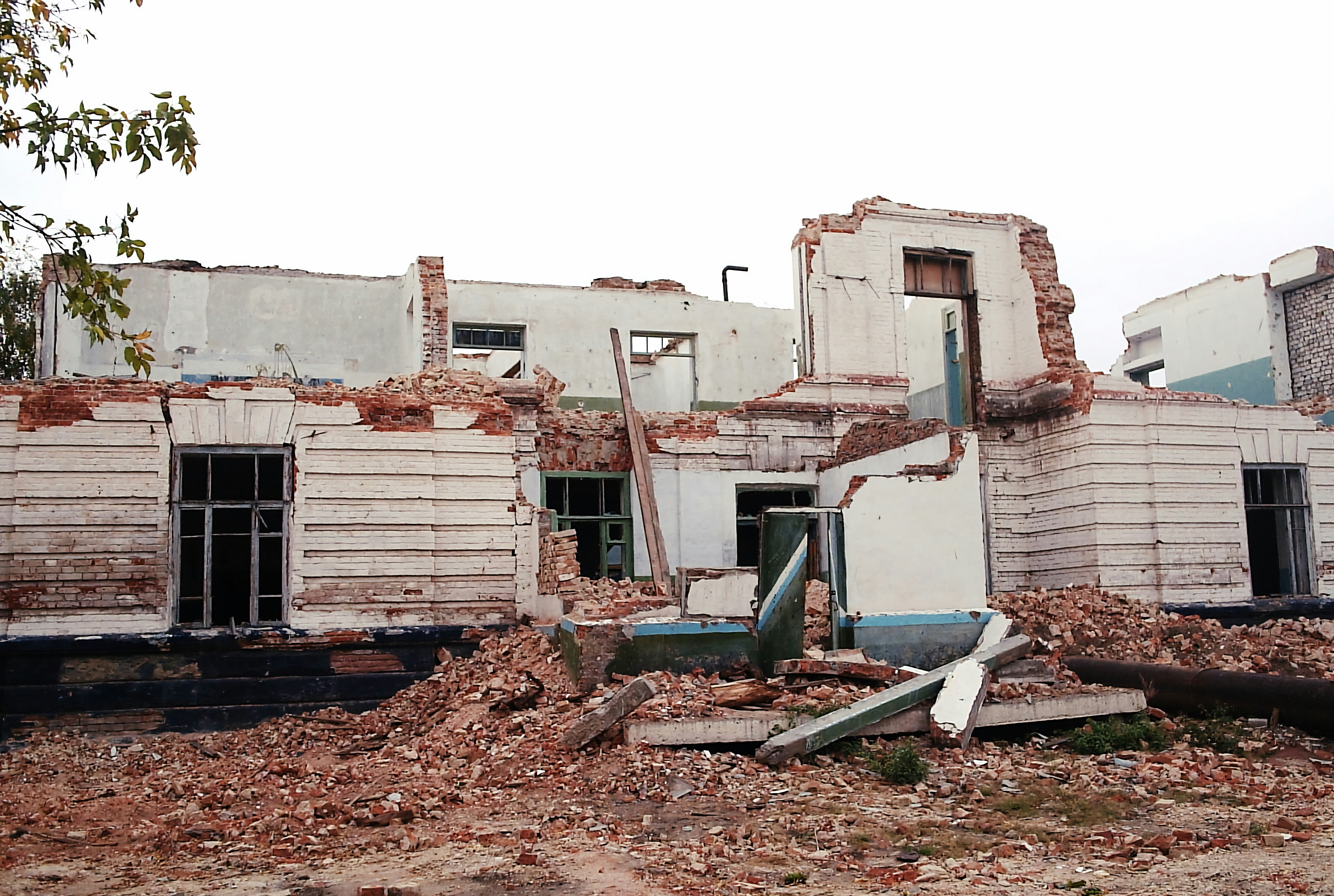 a pile of rubble sitting in front of a building