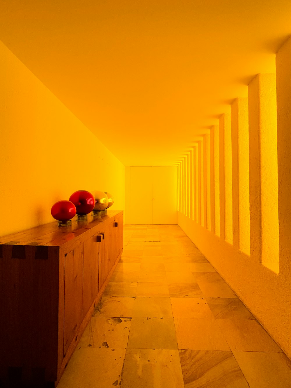 a long hallway with a bunch of fruit on top of it