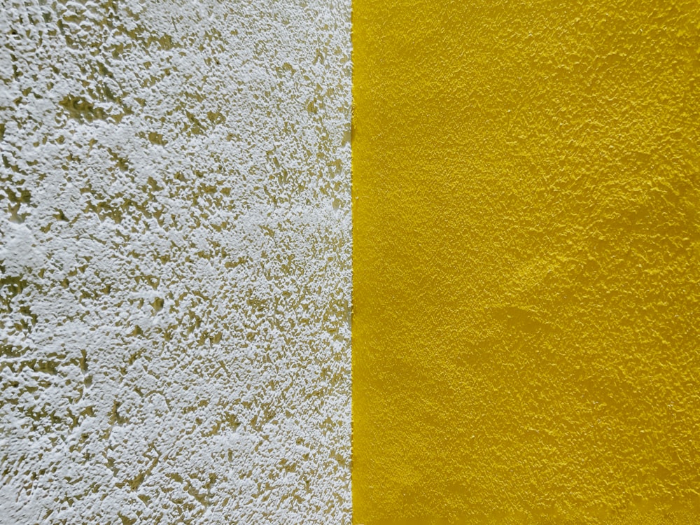 a yellow and white wall with a black and white border