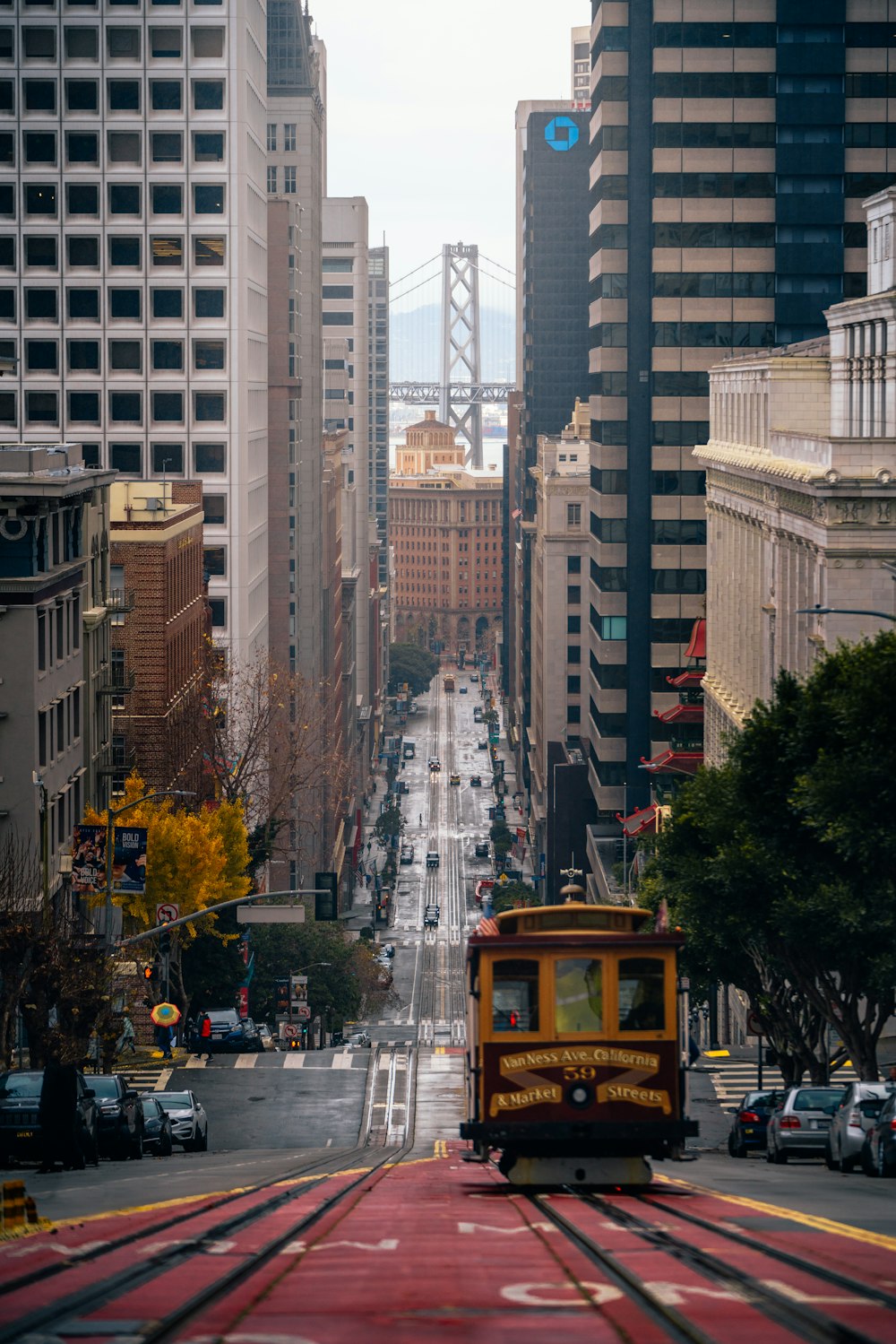 a trolley is going down a city street