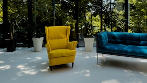 Cozy seating area in the Sky Suite featuring a black leather armchair and neon yellow accent pillows.