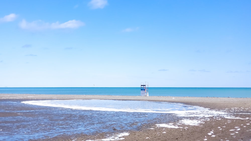 a boat is out on the water at the beach