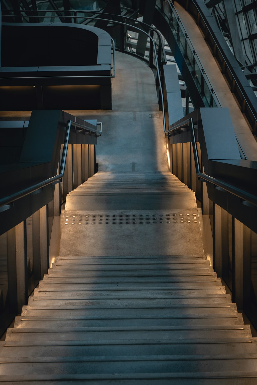 a set of stairs leading up to an escalator