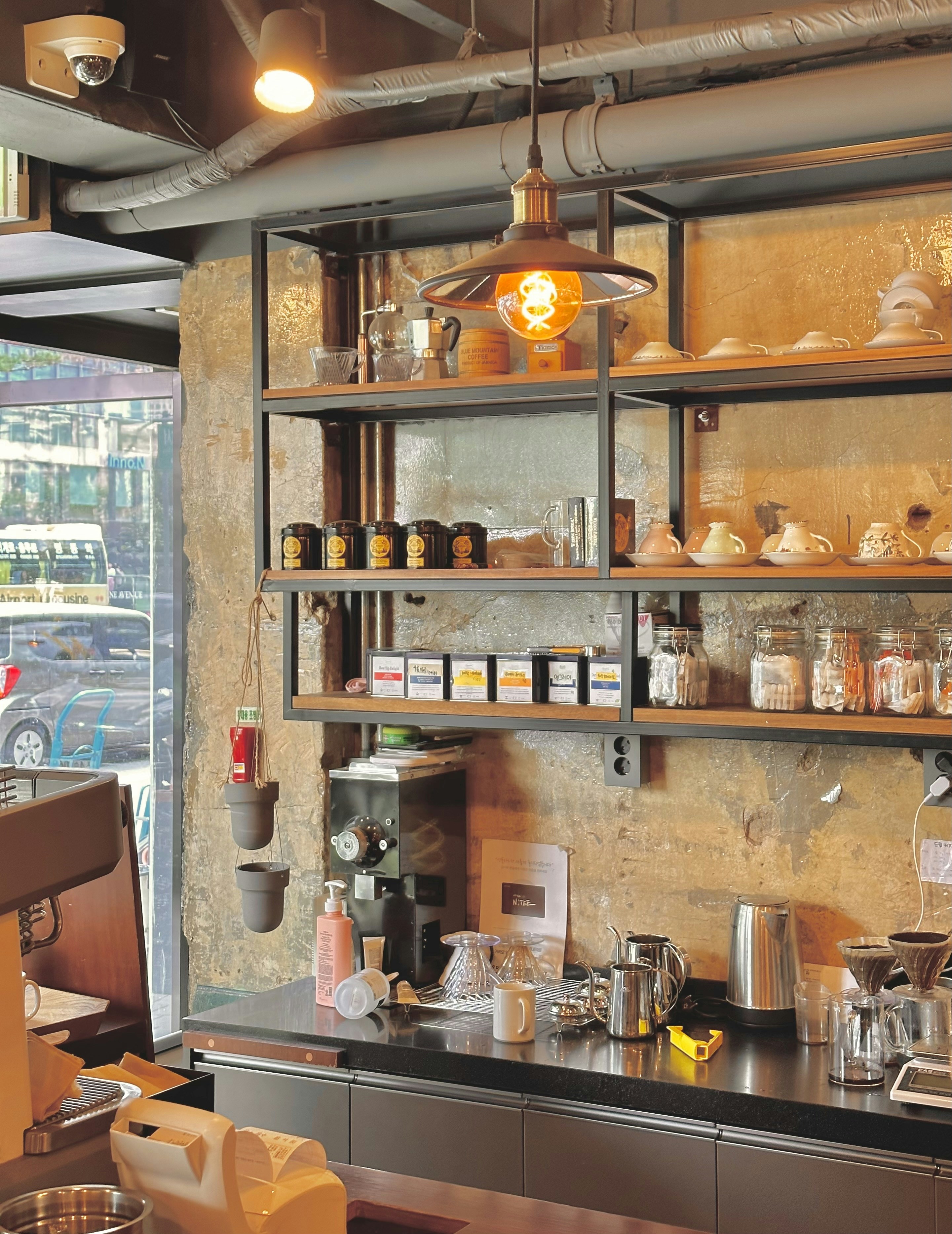 a coffee shop with a lot of coffee on the shelves