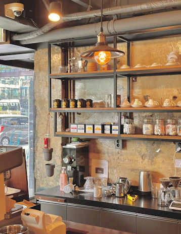 a coffee shop with a lot of coffee on the shelves