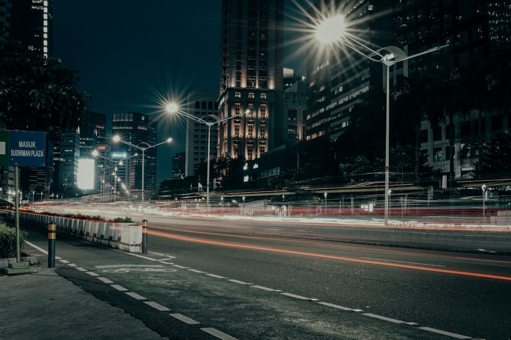 a city street at night with a lot of traffic