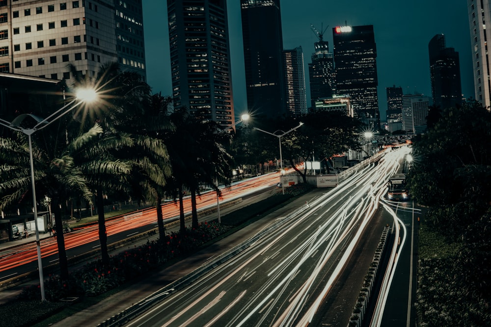 a city street at night with a lot of traffic