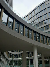 a building with many windows and a clock on it